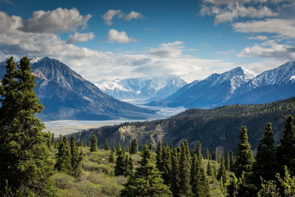 Turquoise mountain lake with snowy peaks